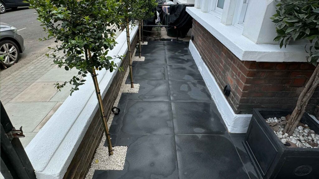 Front garden in Battersea with black porcelain tiles