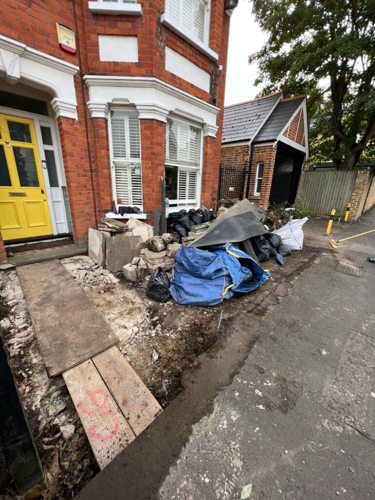 The process of laying a victorian path showing the site before