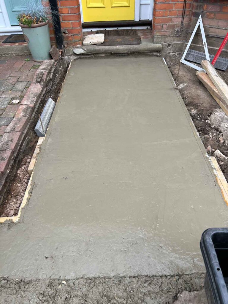 The process of laying a victorian path showing the site before