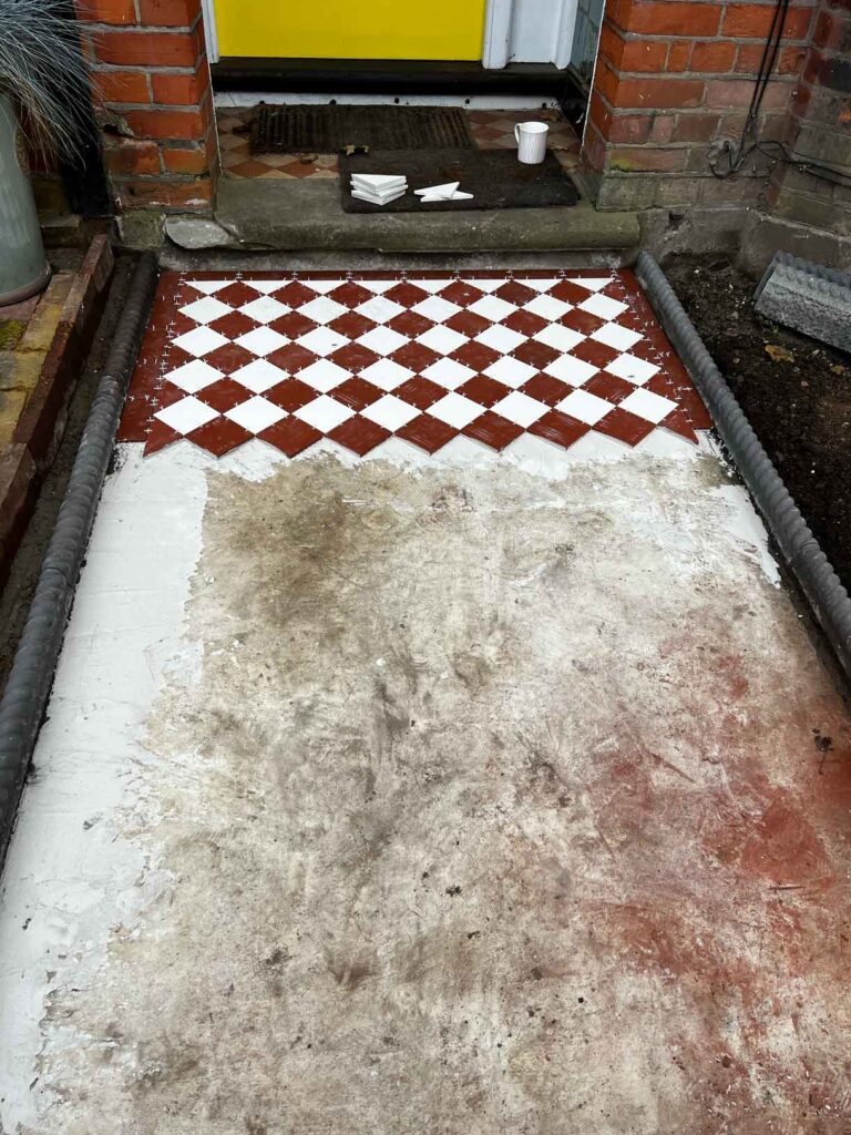 The process of laying a victorian path showing the site before