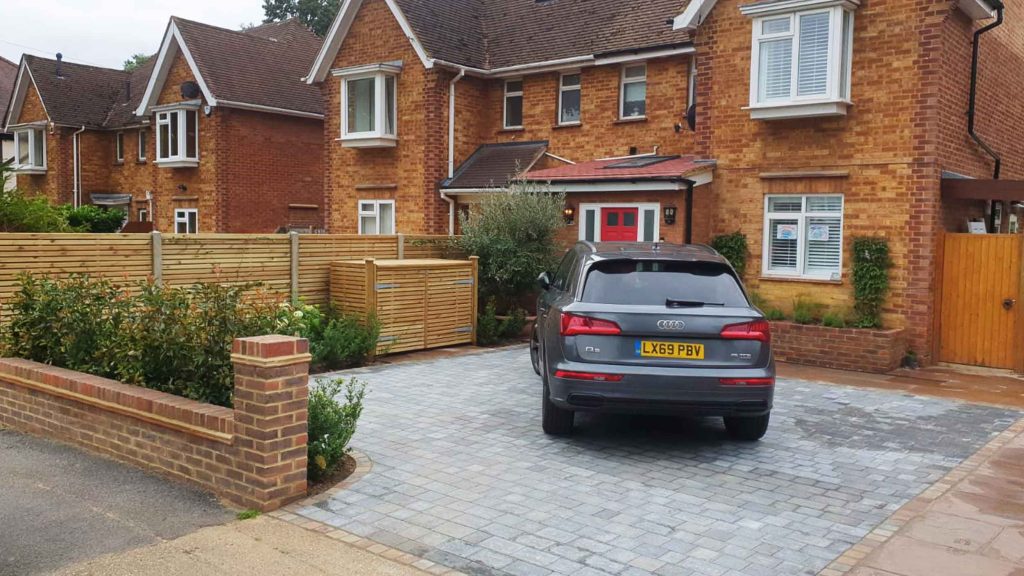 A new driveway with planting and bin storage in Surbiton.