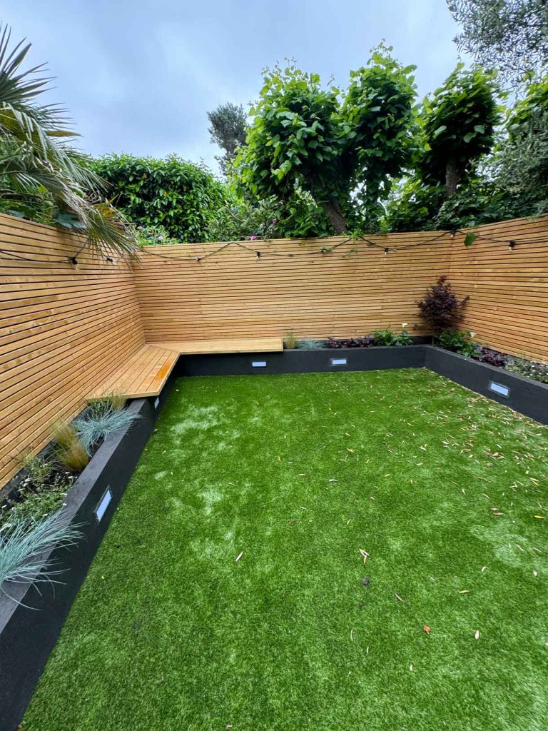 Roof terrace mid-construction with old decking removed and skylight visible.